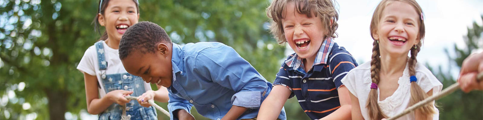 photo of children laughing at a playground