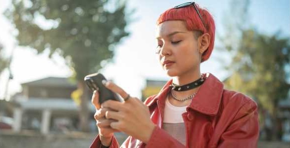 Young woman using 211 youth app